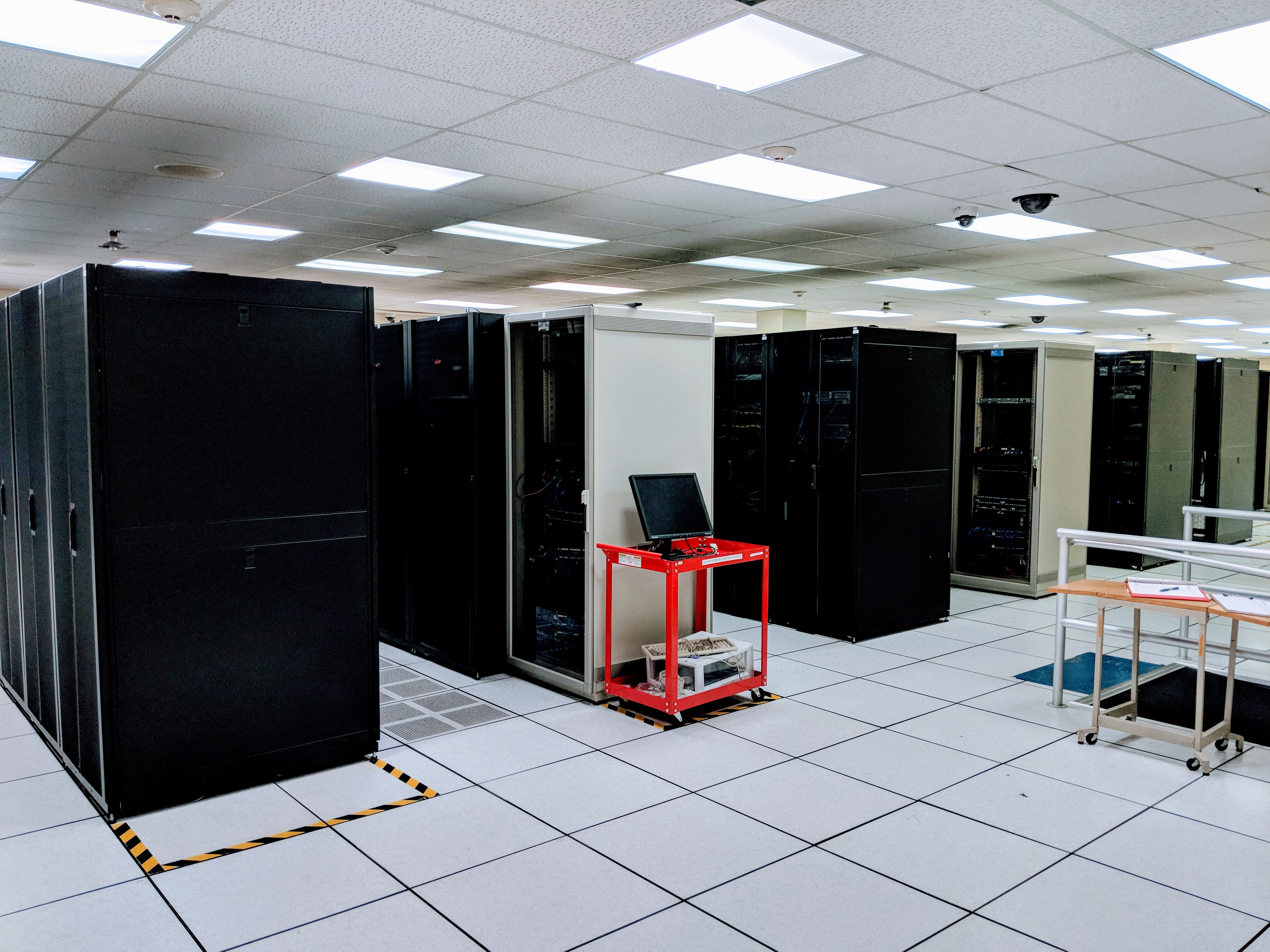 A while room filled with rows of servers.